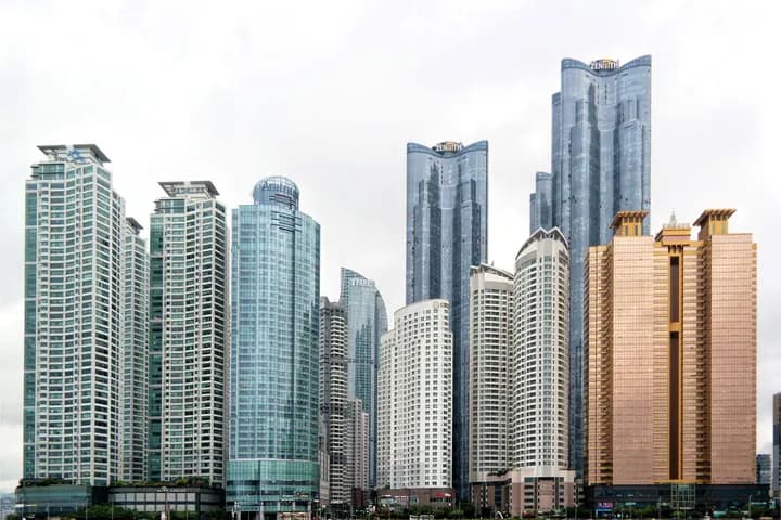 A city skyline of glass towers
